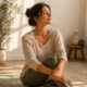 Woman in her late 40s sitting by a window representing bladder health and pelvic floor awareness for women over 40