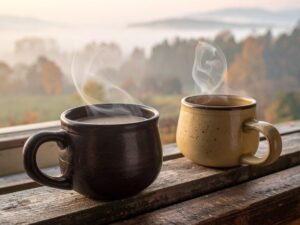 Pelvic floor and sex after menopause — two ceramic mugs on wooden surface — how pelvic floor changes affect intimacy in midlife women