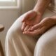 Woman's hands resting calmly representing pelvic organ prolapse awareness and pelvic floor support for women over 40