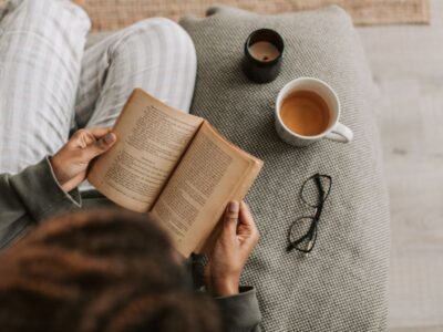 Stress or urgency incontinence — woman reading with tea and candlelight in a cozy moment — understanding the difference between two common patterns
