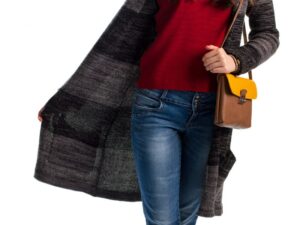 Wearing dark pants just in case — woman in jeans and a cardigan choosing an outfit — the common clothing habit tied to pelvic floor symptoms