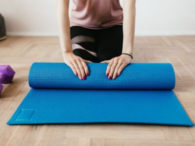 Bladder control exercises for women — yoga mat, water glass, and towel by a sunny window