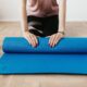 Bladder control exercises for women — yoga mat, water glass, and towel by a sunny window